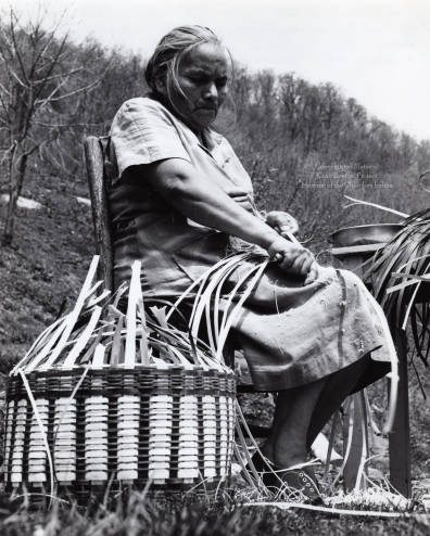 Agnes Welch preparing white oak splits to use in weaving a basket. Image courtesy of Wester Carolina University. 