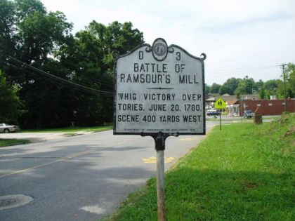 Large metallic marker that reads: "BATTLE OF RAMSOUR'S MILL, Patriot militia led by Col. Francis Locke, on June 20, 1780, defeated Tories led by Maj. John Moore 400 yards west."