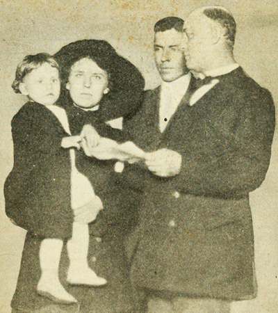 Robert Royal Smithwick of Wendell, N.C. winner of the first Better Baby Contest at the North Carolina State Fair in 1913, receiving a medal from North Carolina Secretary of State J. Bryan Grimes. Image from Archive.org.