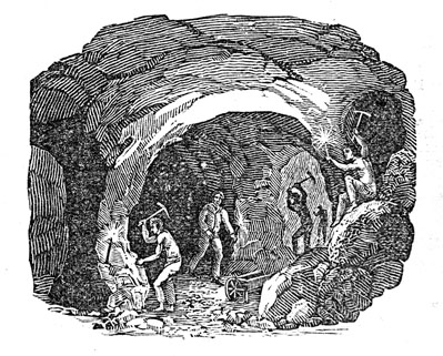 An image of a cave.  There are several men in the cave. They are swinging pickaxes at the cave walls and have candles for light.