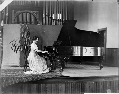 Unidentified girl playing piano at Peace or Meredith College, Raleigh, NC, probably 1910s. From the Barden Collection, North Carolina State Archives, call #:  N.53.16.4348. 