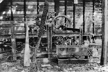 Remains of the printing press of Alexander Manly's Wilmington Daily Record after his newspaper building was burned by a white mob in 1898. North Carolina Collection, University of North Carolina at Chapel Hill Library.