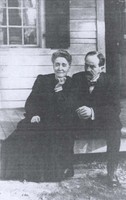"Eben Alexander sitting with his wife, Marion Howard-Smith Alexander, on the front steps of their Chapel Hill house, c. 1900." Southern Historical Collection, Wilson Library.