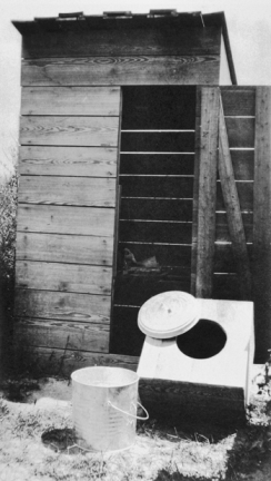 Sampson County privy (showing a new seat before it was installed), ca. 1915. Courtesy of North Carolina Office of Archives and History, Raleigh.