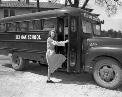 Woman stepping onto Red Oak Farm-Life High School Bus, Nash County, 1952. Image courtesy of the Braswell Library.