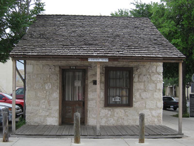 O. Henry'shome in San Antonio, Texas. It is a tiny stone house with a shingle roof.
