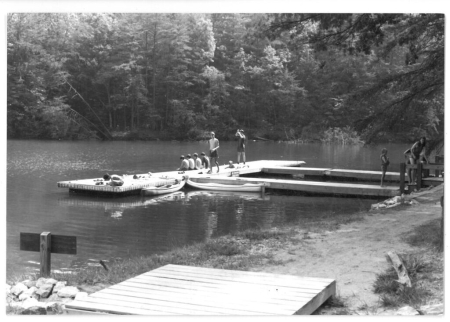 Photograph of swimmers at a dock on the Catawba River, Lake James State Park, ca. 1990. North Carolina State Parks Collection.
