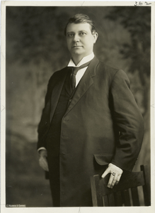 Photograph of Claude Kitchin, taken ca. the 1920s. He is shown standing.
