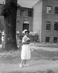 This photograph is of a St. Agnes Hospital Nursing School student in the foreground and a portion of the hospital school in the background. From the Albert Barden Collection, State Archives.