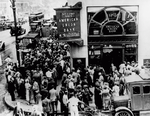 People line a street to get into a bank. Black and white photo.