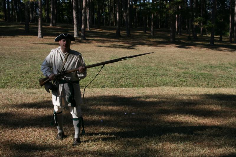 Regulator re-enactor with musket and bayonet Regulator re-enactor with musket and bayonet