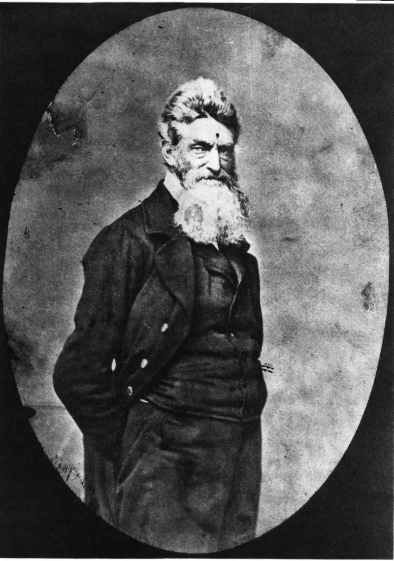 John Brown Photograph showing three-quarter length portrait of John Brown, with beard, facing slightly right.