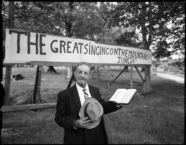 Joe L. Hartley Sr. in front of the Singing on the Mountain sign Joe L. Hartley Sr. in front of the Singing on the Mountain sign
