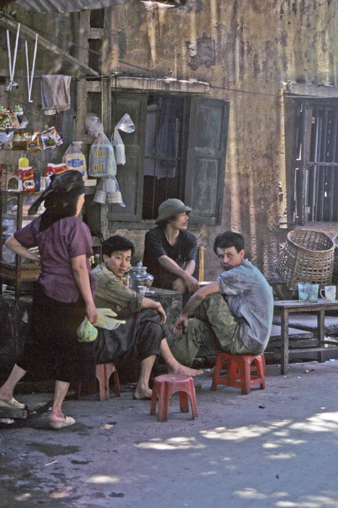 <img typeof="foaf:Image" src="http://statelibrarync.org/learnnc/sites/default/files/images/vietnam_043.jpg" width="683" height="1024" alt="Three men sitting at a streetside cafe in Hanoi, Vietnam" title="Three men sitting at a streetside cafe in Hanoi, Vietnam" />