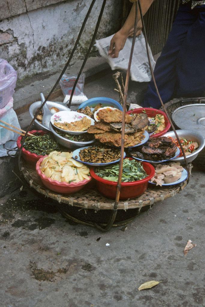 <img typeof="foaf:Image" src="http://statelibrarync.org/learnnc/sites/default/files/images/vietnam_049.jpg" width="683" height="1024" alt="Foods sold by street vendor in Hanoi" title="Foods sold by street vendor in Hanoi" />