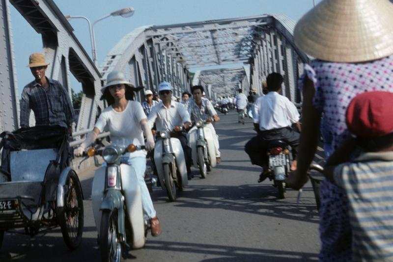 <img typeof="foaf:Image" src="http://statelibrarync.org/learnnc/sites/default/files/images/vietnam_101.jpg" width="1024" height="683" alt="Motorcycle and bycycle traffic crossing bridge at Hue" title="Motorcycle and bycycle traffic crossing bridge at Hue" />