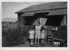 Mrs. Naguchi and two children, Manzanar Relocation Center