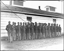 Photograph of all African-American Company E, 4th U.S. Colored Infantry, at Fort Lincoln