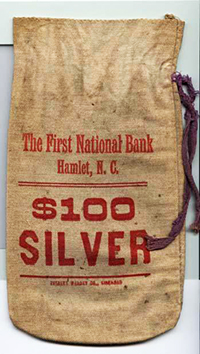 Money bag from the First National Bank in Hamlet. Image from the Museum of History