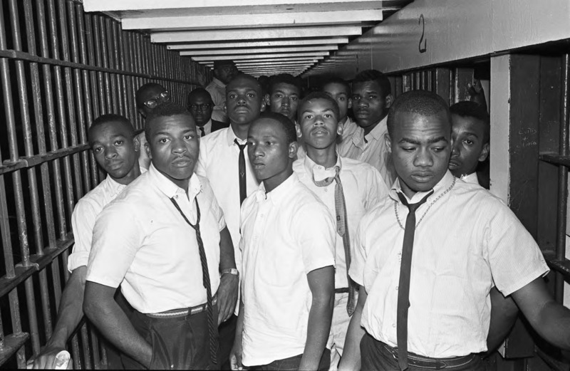 African American men protesters crowded into a jail cell