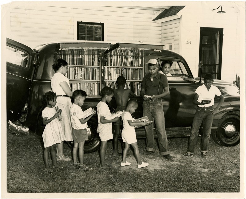 African-American children line up outside of Albemarle Region bookmobile