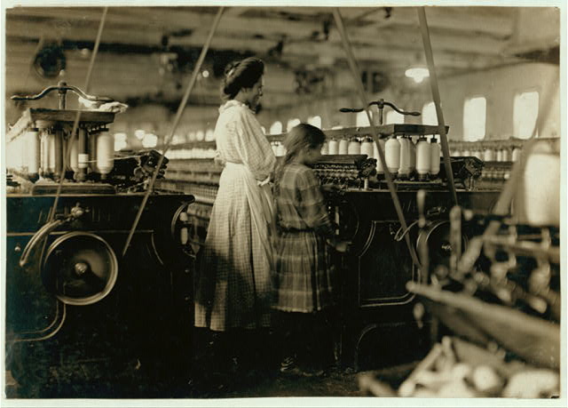 Lewis Hine photo of a small girl working in a Newton Cotton Mills, 1908