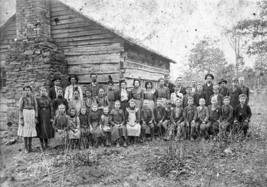 Students and teacher in front of their log school, Davidson County, late nineteenth century. North Carolina Collection, University of North Carolina at Chapel Hill Library.