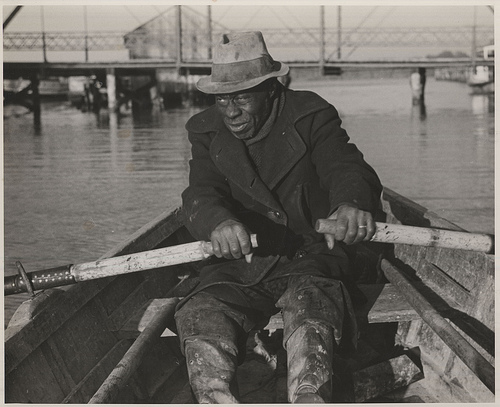 Unidentified man involved in anchor gill net fishing, Edenton, c.1939. From the Charles A. Farrell Photograph Collection, PhC.9, North Carolina State Archives, call #:  PhC9_2_56_4. 
