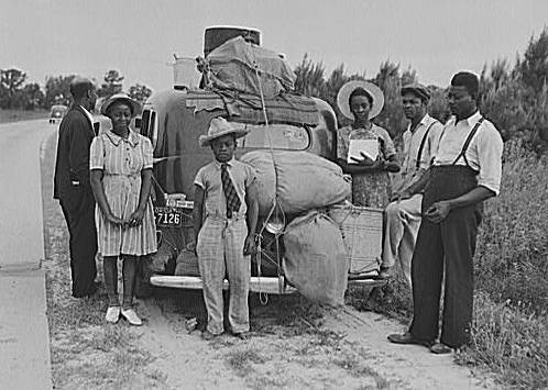 "Group of Florida migrants on their way to Cranberry, New Jersey, to pick potatoes. Near Shawboro, North Carolina." Photograph created by Jack Delano. Image courtesy of Library of Congress. 