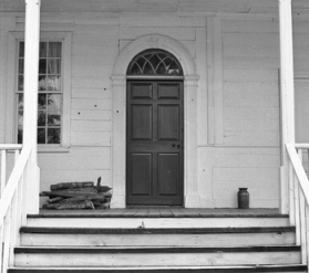 Back door of the Alston House. Note the bullet holes around the door. Courtesy of North Carolina Office of Archives and History, Raleigh.