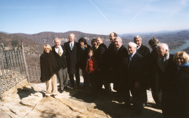 Governor Easley, Lucius and Todd Morse and family members, State Parks Director Lewis Ledford, and other dignitaries at the announcement of the State of North Carolina purchasing Chimney Rock Park from the Morse Family, January 2007. From the collection of North Carolina State Parks.