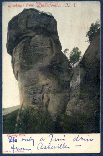 "Greetings from Rutherfordton, N.C.," postcard image of Chimney Rock, ca. 1907.  Handwritten text says "It's only a 7 mile drive from Asheville --".  Item 	H.1971.118.17 from the collection of the N.C. Museum of History. Used courtesy of the N.C. Department of Natural and Cultural Resources.