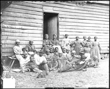 "Contrabands" at Foller's House, Cumberland Landing, Virginia.  Photograph, May 14, 1862 by James F. Gibson.  Civil War Glass Negatives and Related Prints, Library of Congress. 