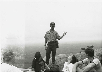 Visitors enjoying an educational program, Hanging Rock State Park. State Parks Collection, North Carolina Digital Collections. 