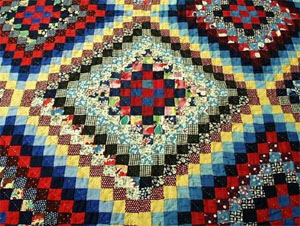 Close-up of "postage stamp" quilt, made by Mamie Dameron, ca. 1935, Gaston County, N.C.  From the collections of the North Carolina Museum of History, used courtesy of the North Carolina Department of Cultural Resources. 