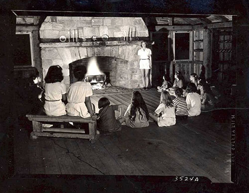 Storytelling at camp, ca. 1950, Crabtree Creek State Park, now Umstead State Park.  North Carolina State Parks Collection, NC Digital Collections.  	Prior permission from the North Carolina Division of State Parks is required for any commercial use.