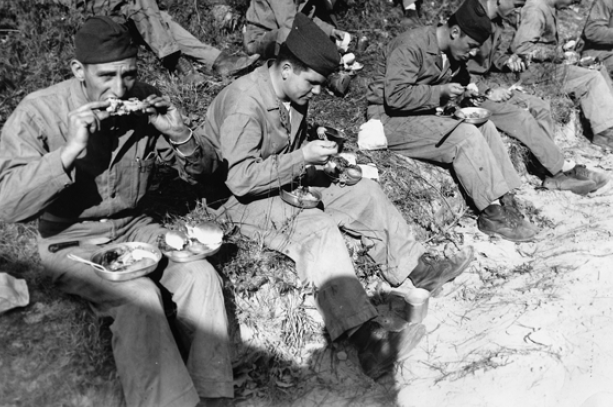 Camp Lejeune marines take a training break to enjoy their Thanksgiving meal.