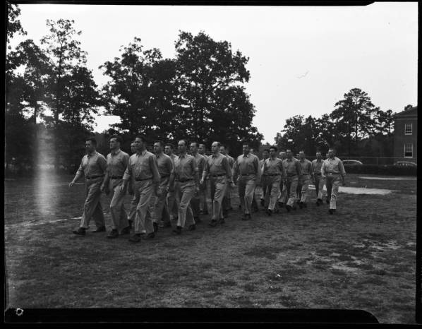 Black and white photo showing pre-flight students drilling in formation.