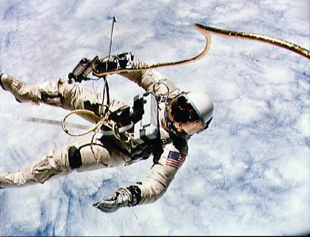 Astronaut Ed White in astronaut gear in outer space.
