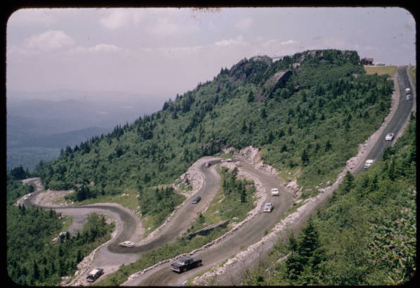 Cars using a windy mountain road to reach the summit.