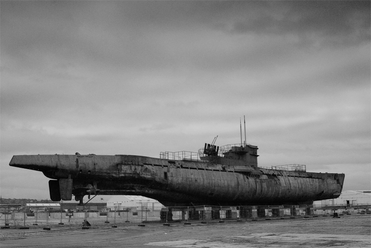 German U-boat. It is docked on land. Black and white photo.