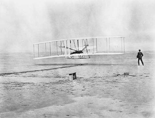 The first powered airplane flight at Kitty Hawk, 17 Dec. 1903. Courtesy of North Carolina Office of Archives and History, Raleigh.