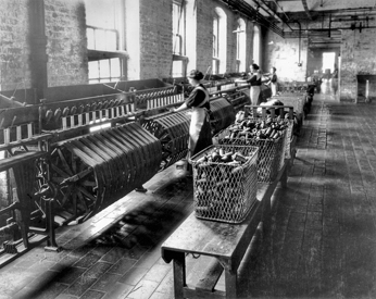Reeling yarn at a cotton mill, ca. 1925. North Carolina Collection, University of North Carolina at Chapel Hill Library.