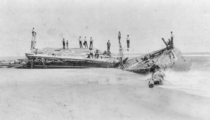 Local residents and perhaps crew members pose on the wreck of the Priscilla, which ran aground at Gull Shoal in Dare County in August 1899. North Carolina Collection, University of North Carolina at Chapel Hill Library.