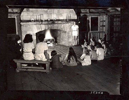 Storytelling at camp, ca. 1950, Crabtree Creek State Park, now Umstead State Park. North Carolina State Parks Collection, NC Digital Collections. Prior permission from the North Carolina Division of State Parks is required for any commercial use.