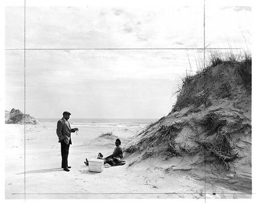 Civil and human rights activist C. Payne Lewis and Freddie Hill Lewis picknicking at Hammocks Beach, 1950s. From the North Carolina State Parks Collection, NC Digital Collections. Prior permission of the Division of Parks and Recreation required for any commercial use.