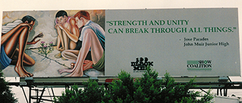 Photograph of "Growth Through Limits" painting by Ernie Barnes. Shown on a billboard in the wake of the 1992 Los Angeles riots. By DrPenfield, 1992.  Wikimedia Commons, license CC BY-SA 3.0.
