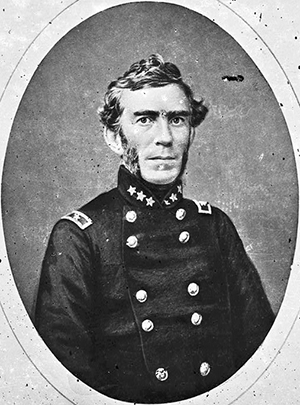 Black and white depiction of Braxton Bragg. He is pictured with a soldiers coat. He has medium hair and sideburns. 