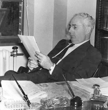 A 1952 photograph of David Leroy Corbitt in his office. Image from the North Carolina Musuem of History.