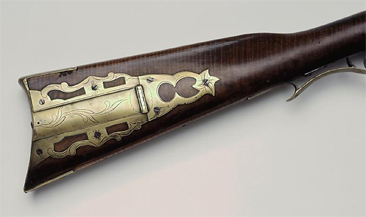 Image of rifle stock with ornate brass patch box, made by David Kennedy, circa 1820-1850, made at Mechanics Hill.  Item H.1945.81.20 from the collections of the North Carolina Museum of History. Used courtesy of the North Carolina Department of Cultural Resources. 